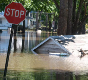 A garage that floated down a street is still submerged in floodwater June 16, 2008 in Cedar Rapids, Iowa. Officials are conducting door to door home inspections before allowing residents in flood affected areas as most of the homes along the Cedar River are no longer structurally sound. (Photo by David Greedy/Getty Images)